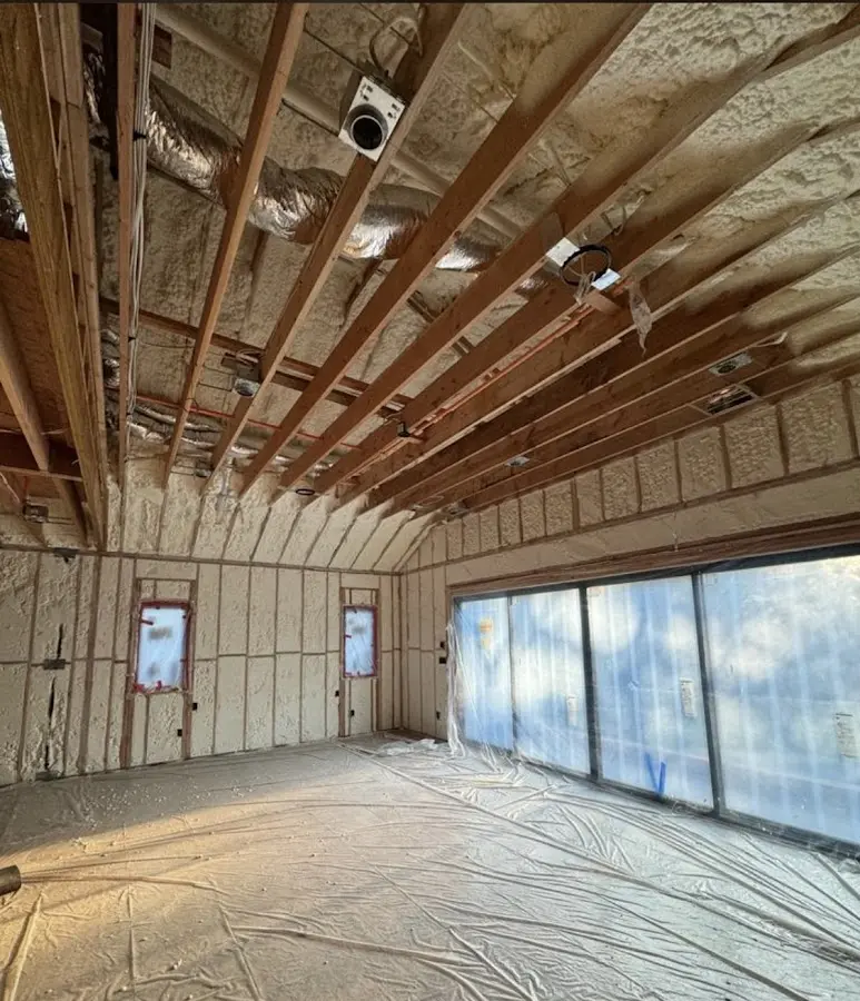Interior walls and ceiling insulated with spray foam during new construction in Litchfield